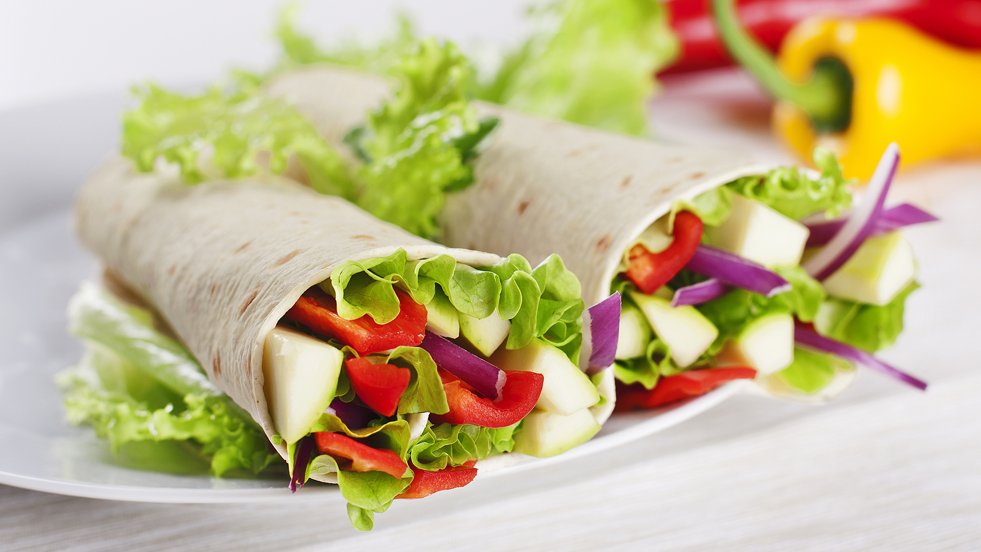 Healthy vegetarian rainbow veggie wrap lunch.