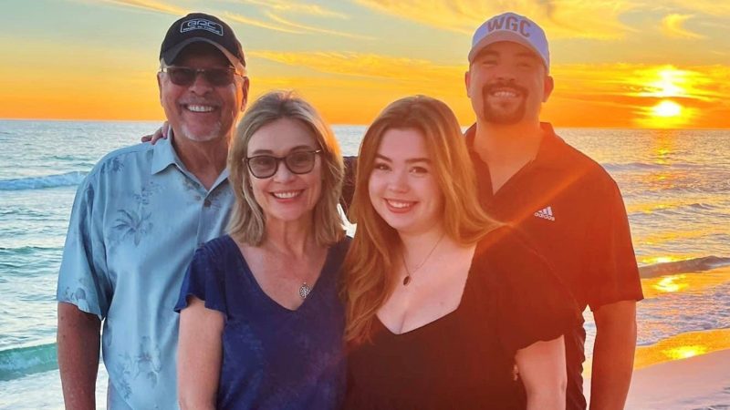 Patti and Frank Reed and family photo at sunset