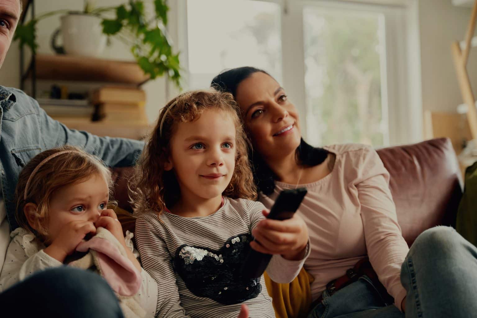 a mother with two children watching classic Canadian tv shows with a good message