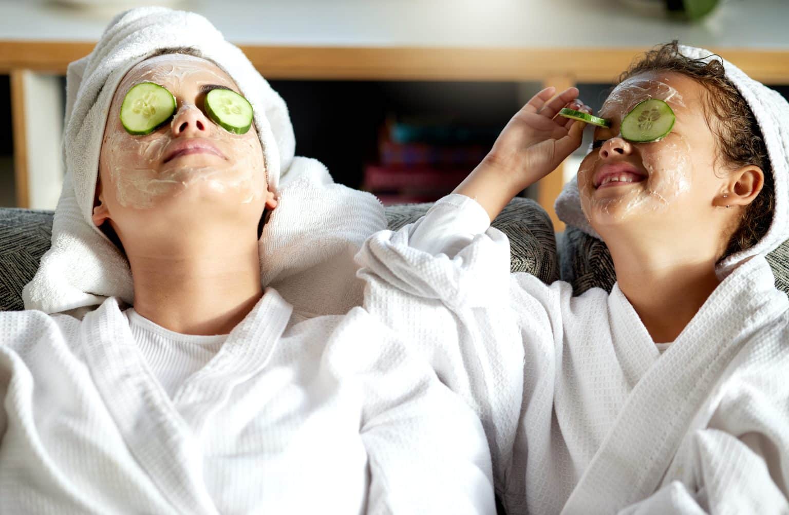 Happy, carefree and relaxed mother and daughter having a relaxing spa day together signaling the importance of rest.
