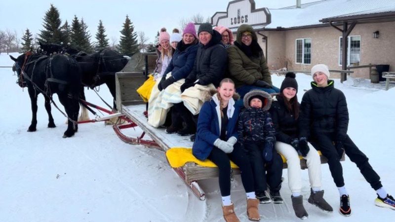 Hunter family having a sleigh ride at Dallas Valley Ranch.