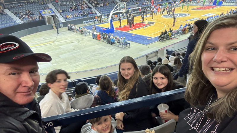 Hunter family watching the Harlem Globetrotters.