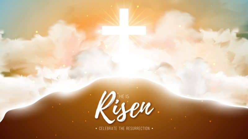 An image of a cross in the sky up on a hill with the words He is Risen.