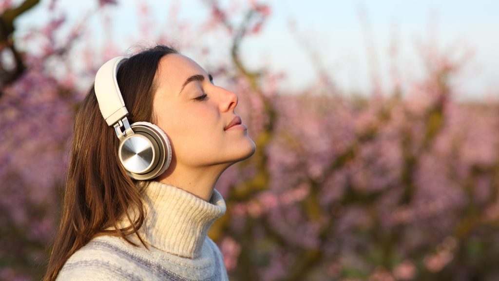 young lady listening to headphones